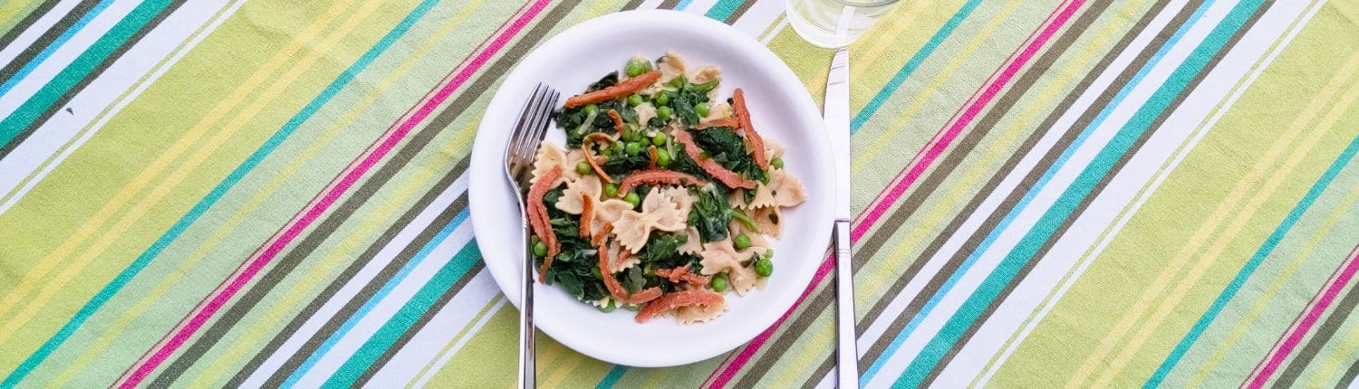 Farfalle met spinazie en erwten header Farfalle met spinazie en erwten